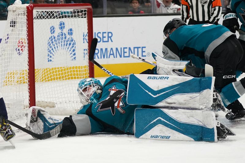 Dec 3, 2025; San Jose, California, USA;  San Jose Sharks goaltender Yaroslav Askarov (30) allows a goal to the Washington Capitals in the first period at SAP Center at San Jose. Mandatory Credit: David Gonzales-Imagn Images