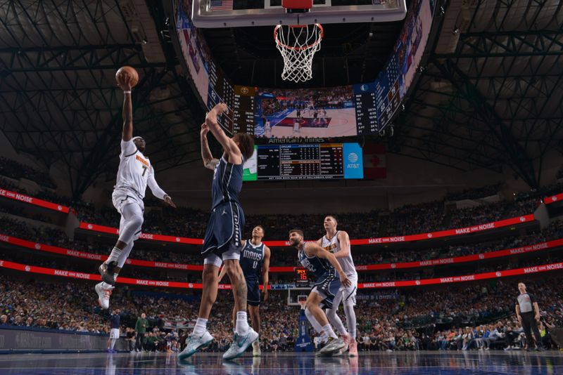 DALLAS, TX - MARCH 17: Reggie Jackson #7 of the Denver Nuggets drives to the basket during the game against the Dallas Mavericks on March 17, 2024 at the American Airlines Center in Dallas, Texas. NOTE TO USER: User expressly acknowledges and agrees that, by downloading and or using this photograph, User is consenting to the terms and conditions of the Getty Images License Agreement. Mandatory Copyright Notice: Copyright 2024 NBAE (Photo by Glenn James/NBAE via Getty Images)