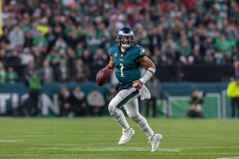 Philadelphia Eagles quarterback Jalen Hurts (1) rolls out against the San Francisco 49ers in an NFL football game, Sunday, Dec. 3, 2023, in Philadelphia, PA. 49ers defeat the Eagles 42-19. (AP Photo/Jeff Lewis)