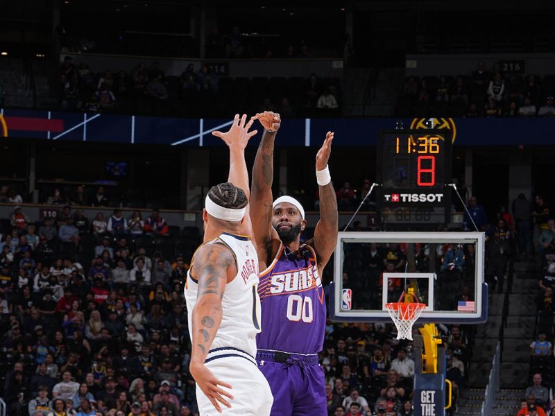 DENVER, CO - OCTOBER 13: Royce O'Neale #00 of the Phoenix Suns shoots a three point basket during the game against the Denver Nuggets on October 13, 2024 at Ball Arena in Denver, Colorado. NOTE TO USER: User expressly acknowledges and agrees that, by downloading and/or using this Photograph, user is consenting to the terms and conditions of the Getty Images License Agreement. Mandatory Copyright Notice: Copyright 2024 NBAE (Photo by Garrett Ellwood/NBAE via Getty Images)