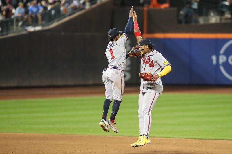 Aug 11, 2023; New York City, New York, USA; Atlanta Braves second baseman Ozzie Albies (1) and right fielder Ronald Acuna Jr. (13) celebrate after defeating the New York Mets at Citi Field. Mandatory Credit: Wendell Cruz-USA TODAY Sports