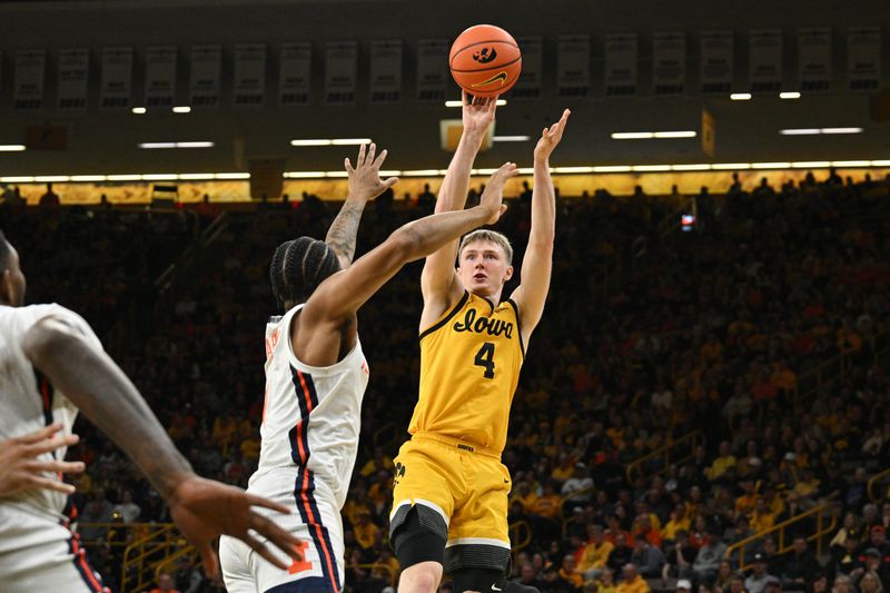 Mar 10, 2024; Iowa City, Iowa, USA; Iowa Hawkeyes guard Josh Dix (4) shoots the ball over Illinois Fighting Illini guard Justin Harmon (4) during the second half at Carver-Hawkeye Arena. Mandatory Credit: Jeffrey Becker-USA TODAY Sports