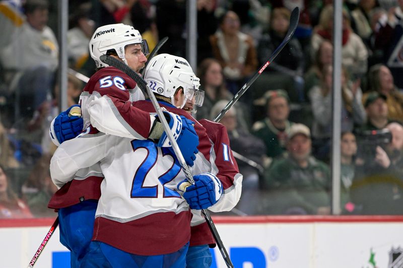 Nov 24, 2023; Saint Paul, Minnesota, USA; Colorado Avalanche defenseman Kurtis MacDermid (56) celebrates his goal against the Minnesota Wild with forward Frederik Olofsson (22) and forward Andrew Cogliano (11) during the third period at Xcel Energy Center. Mandatory Credit: Nick Wosika-USA TODAY Sports