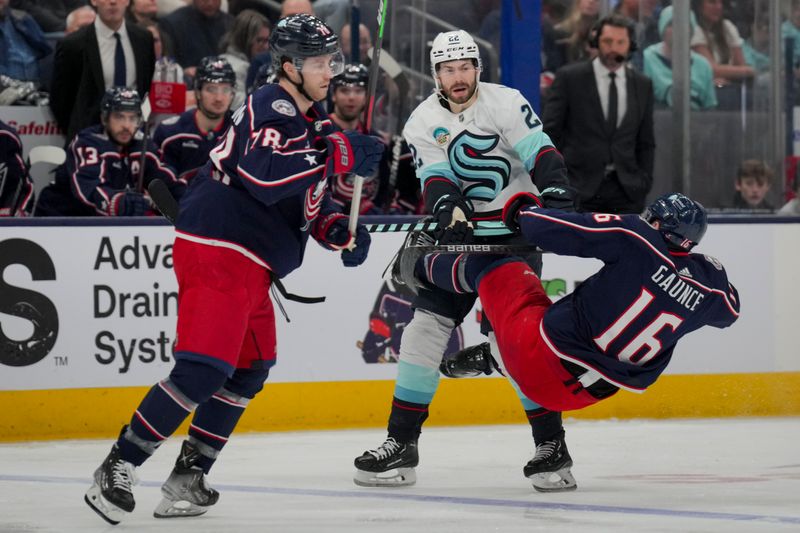 cJan 13, 2024; Columbus, Ohio, USA;  Seattle Kraken right wing Oliver Bjorkstrand (22) checks Columbus Blue Jackets center Brendan Gaunce (16) in the third period at Nationwide Arena. Mandatory Credit: Aaron Doster-USA TODAY Sports