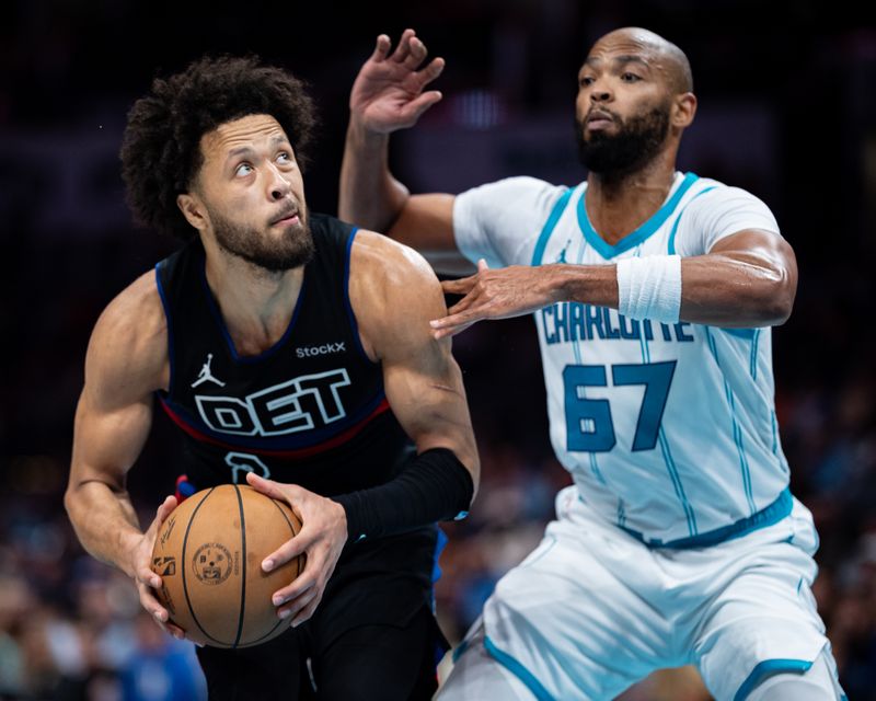 CHARLOTTE, NORTH CAROLINA - NOVEMBER 06: Cade Cunningham #2 of the Detroit Pistons goes to the basket while guarded by Taj Gibson #67 of the Charlotte Hornets in the third quarter during their game at Spectrum Center on November 06, 2024 in Charlotte, North Carolina. NOTE TO USER: User expressly acknowledges and agrees that, by downloading and or using this photograph, User is consenting to the terms and conditions of the Getty Images License Agreement. (Photo by Jacob Kupferman/Getty Images)