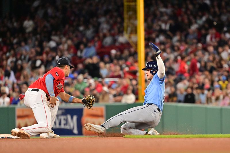 Sep 27, 2024; Boston, Massachusetts, USA; Boston Red Sox second baseman Vaughn Grissom (5) tags Tampa Bay Rays shortstop Taylor Walls (6) out during the eighth inning at Fenway Park. Mandatory Credit: Eric Canha-Imagn Images