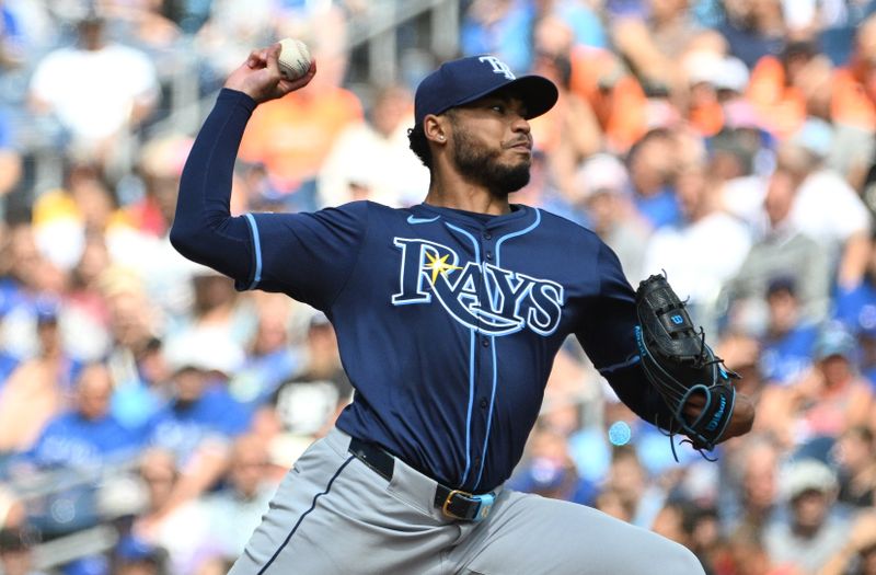 Jul 25, 2024; Toronto, Ontario, CAN; Tampa Bay Rays starting pitcher Taj Bradley (45) delivers against the Toronto Blue Jays in the first inning at Rogers Centre. Mandatory Credit: Dan Hamilton-USA TODAY Sports