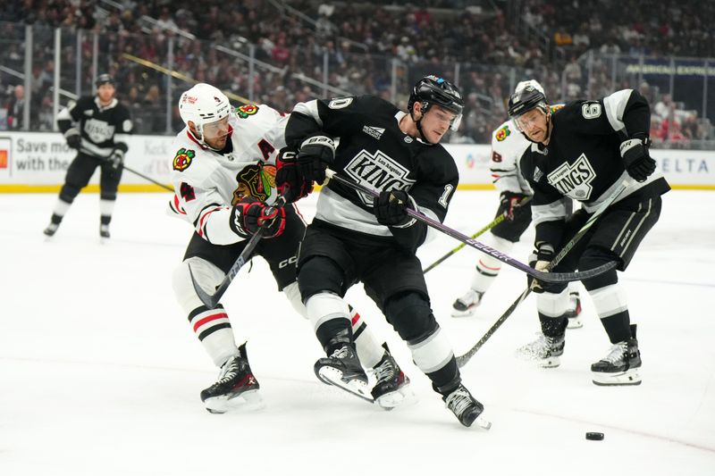 Nov 2, 2024; Los Angeles, California, USA; LA Kings left wing Tanner Jeannot (10) and Chicago Blackhawks defenseman Seth Jones (4) battle for the puck in the second period at Crypto.com Arena. Mandatory Credit: Kirby Lee-Imagn Images