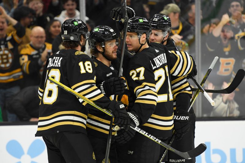 Jan 4, 2024; Boston, Massachusetts, USA; Boston Bruins right wing David Pastrnak (88) celebrates his goal with center Pavel Zacha (18) defenseman Hampus Lindholm (27) and defenseman Brandon Carlo (25) during the first period against the Pittsburgh Penguins at TD Garden. Mandatory Credit: Bob DeChiara-USA TODAY Sports