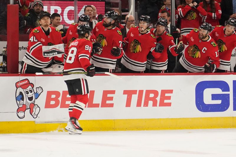 Dec 1, 2024; Chicago, Illinois, USA; Chicago Blackhawks center Connor Bedard (98) celebrates his goal against the Columbus Blue Jackets during the first period at United Center. Mandatory Credit: David Banks-Imagn Images