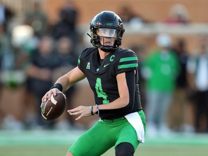 Nov 9, 2024; Denton, Texas, USA; North Texas Mean Green quarterback Chandler Morris (4) throws a pass against the Army Black Knights during the second half at DATCU Stadium. Mandatory Credit: Danny Wild-Imagn Images