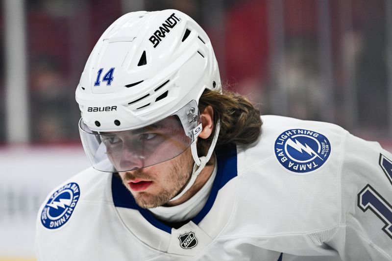 Jan 21, 2025; Montreal, Quebec, CAN; Tampa Bay Lightning center Conor Geekie (14) looks on during warm-up before the game against the Montreal Canadiens at Bell Centre. Mandatory Credit: David Kirouac-Imagn Images