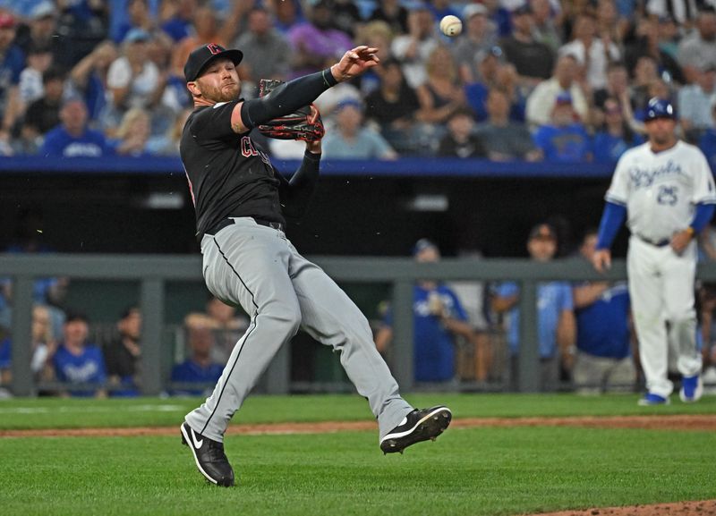 Jun 27, 2024; Kansas City, Missouri, USA; Cleveland Guardians starting pitcher Ben Lively (39) makes a late throw to first base in the sixth inning against the Kansas City Royals at Kauffman Stadium. Mandatory Credit: Peter Aiken-USA TODAY Sports