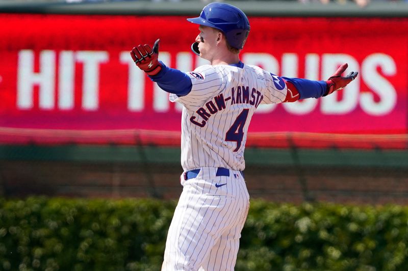 Jun 1, 2025; Chicago, Illinois, USA; Chicago Cubs outfielder Pete Crow-Armstrong (4) gestures after reaching second base against the Cincinnati Reds during the seventh inning at Wrigley Field. Mandatory Credit: David Banks-Imagn Images