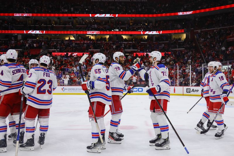 May 26, 2024; Sunrise, Florida, USA; New York Rangers defenseman K'Andre Miller (79) and center Filip Chytil (72) celebrate after winning against the Florida Panthers in game three of the Eastern Conference Final of the 2024 Stanley Cup Playoffs at Amerant Bank Arena. Mandatory Credit: Sam Navarro-USA TODAY Sports