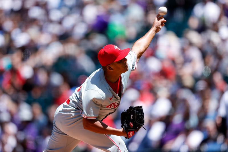 May 26, 2024; Denver, Colorado, USA; Philadelphia Phillies starting pitcher Ranger Suarez (55) pitches in the first inning against the Colorado Rockies at Coors Field. Mandatory Credit: Isaiah J. Downing-USA TODAY Sports