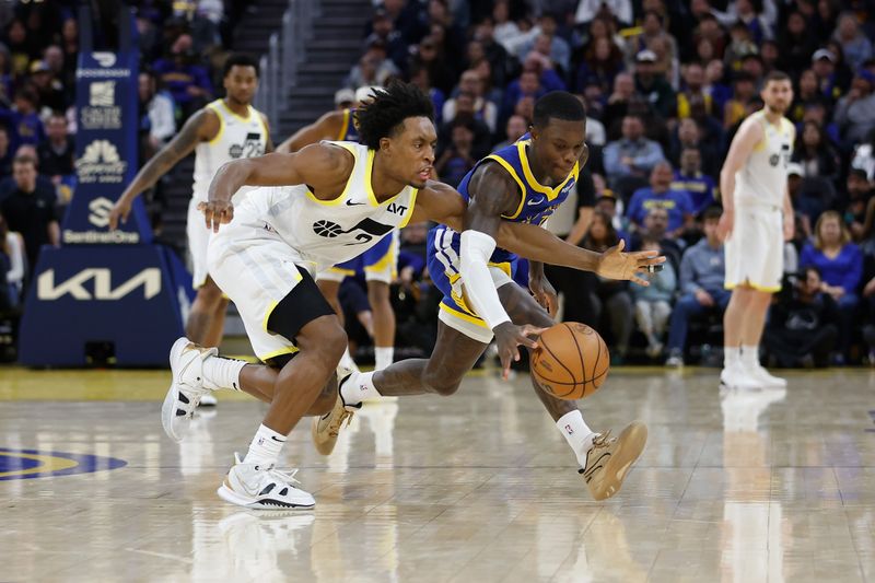 SAN FRANCISCO, CALIFORNIA - JANUARY 28: Collin Sexton #2 of the Utah Jazz and Dennis Schroder #71 of the Golden State Warriors compete for the ball in the fourth quarter at Chase Center on January 28, 2025 in San Francisco, California. NOTE TO USER: User expressly acknowledges and agrees that, by downloading and or using this photograph, User is consenting to the terms and conditions of the Getty Images License Agreement. (Photo by Lachlan Cunningham/Getty Images)