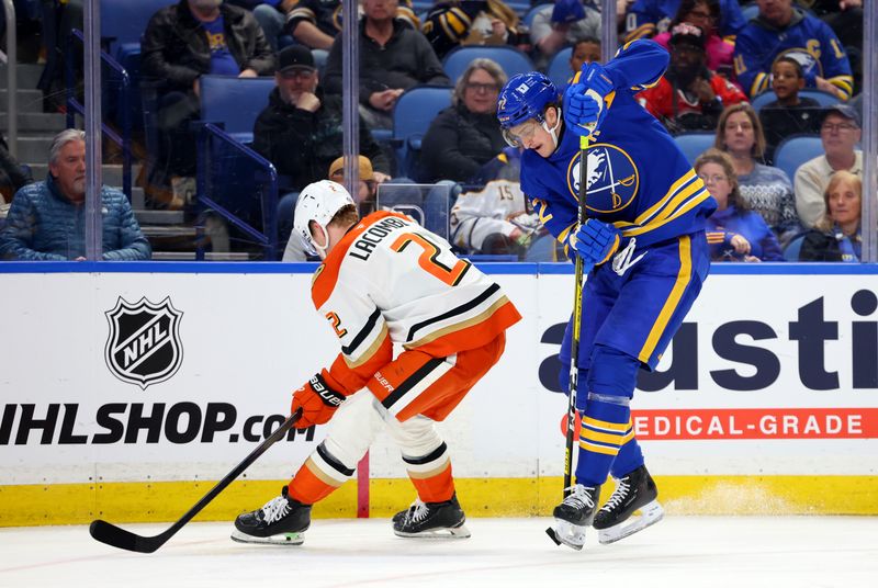 Feb 25, 2025; Buffalo, New York, USA;  Buffalo Sabres center Tage Thompson (72) controls the puck as Anaheim Ducks defenseman Jackson LaCombe (2) tries to defend during the second period at KeyBank Center. Mandatory Credit: Timothy T. Ludwig-Imagn Images