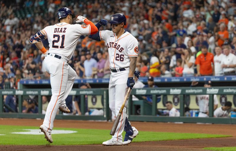 Jul 5, 2023; Houston, Texas, USA;Houston Astros first baseman Bligh Madris (26) celebrates with Houston Astros catcher Yainer Diaz (21) after Diaz's home run against the Colorado Rockies in the second inning at Minute Maid Park. Mandatory Credit: Thomas Shea-USA TODAY Sports
