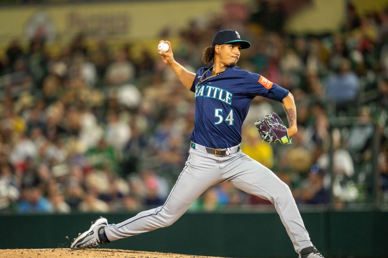 May 6, 2025; West Sacramento, California, USA;  Seattle Mariners pitcher Carlos Vargas (54) delivers a pitch during the ninth inning against the  Athletics at Sutter Health Park. Mandatory Credit: Neville E. Guard-Imagn Images