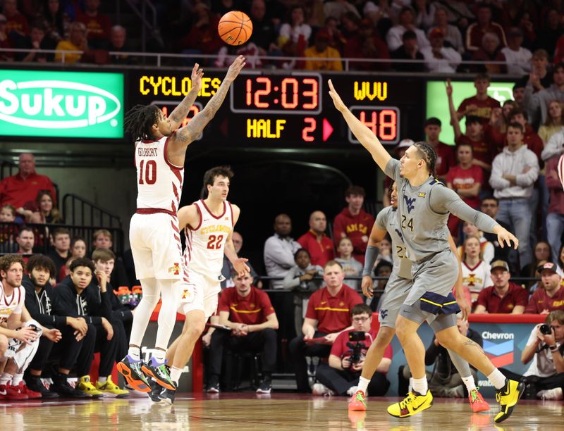 Feb 24, 2024; Ames, Iowa, USA; Iowa State Cyclones guard Keshon Gilbert (10) shoots over West Virginia Mountaineers forward Patrick Suemnick (24) during the second half at James H. Hilton Coliseum. Mandatory Credit: Reese Strickland-USA TODAY Sports