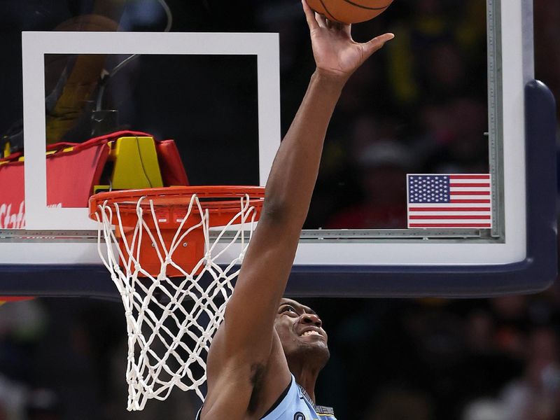 DENVER, COLORADO - MARCH 25: Trey Jemison #5 of the Memphis Grizzlies commits goaltending against the Denver Nuggets in the third quarter at Ball Arena on March 25, 2024 in Denver, Colorado. NOTE TO USER: User expressly acknowledges and agrees that, by downloading and or using this photograph, User is consenting to the terms and conditions of the Getty Images License Agreement. (Photo by Matthew Stockman/Getty Images)