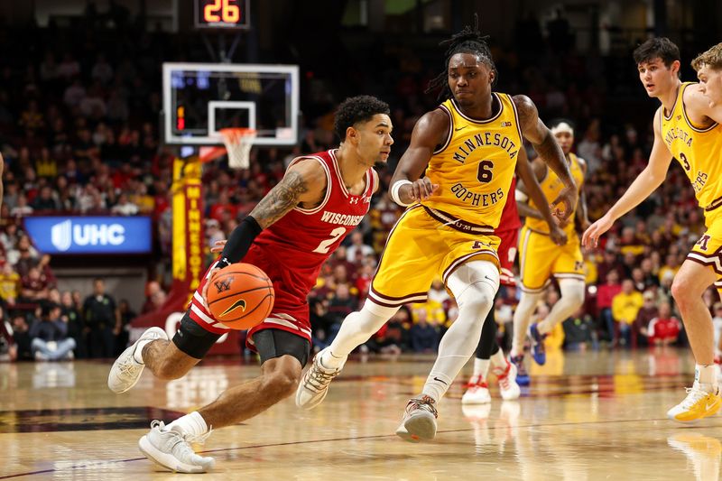 Jan 13, 2026; Minneapolis, Minnesota, USA; Wisconsin Badgers guard Nick Boyd (2) works around Minnesota Golden Gophers guard Langston Reynolds (6) during the second half at Williams Arena. Mandatory Credit: Matt Krohn-Imagn Images