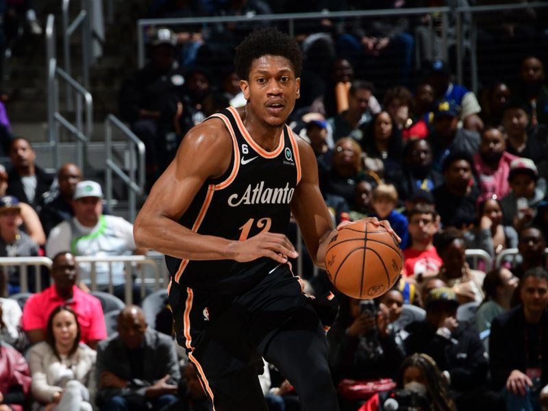 ATLANTA, GA - MARCH 17: De'Andre Hunter #12 of the Atlanta Hawks dribbles the ball during the game against the Golden State Warriors on March 17, 2023 at State Farm Arena in Atlanta, Georgia.  NOTE TO USER: User expressly acknowledges and agrees that, by downloading and/or using this Photograph, user is consenting to the terms and conditions of the Getty Images License Agreement. Mandatory Copyright Notice: Copyright 2023 NBAE (Photo by Scott Cunningham/NBAE via Getty Images)