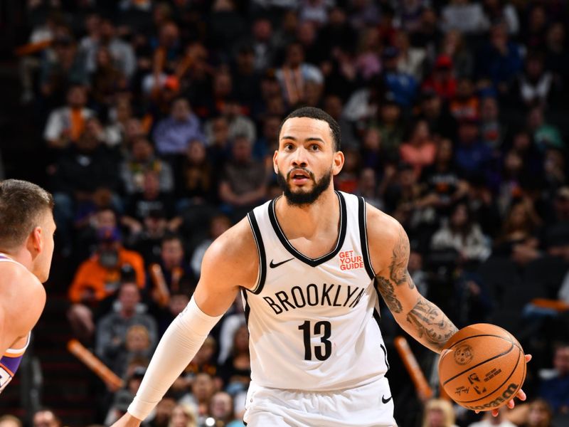 PHOENIX, AZ - NOVEMBER 27: Tyrese Martin #13 of the Brooklyn Nets dribbles the ball during the game against the Phoenix Suns on November 27, 2024 at Footprint Center in Phoenix, Arizona. NOTE TO USER: User expressly acknowledges and agrees that, by downloading and or using this photograph, user is consenting to the terms and conditions of the Getty Images License Agreement. Mandatory Copyright Notice: Copyright 2024 NBAE (Photo by Barry Gossage/NBAE via Getty Images)