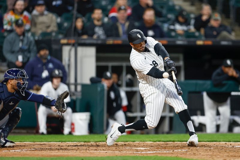 Apr 26, 2024; Chicago, Illinois, USA; Chicago White Sox left fielder Tommy Pham (28) bats against the Tampa Bay Rays during the fourth inning at Guaranteed Rate Field. Mandatory Credit: Kamil Krzaczynski-USA TODAY Sports