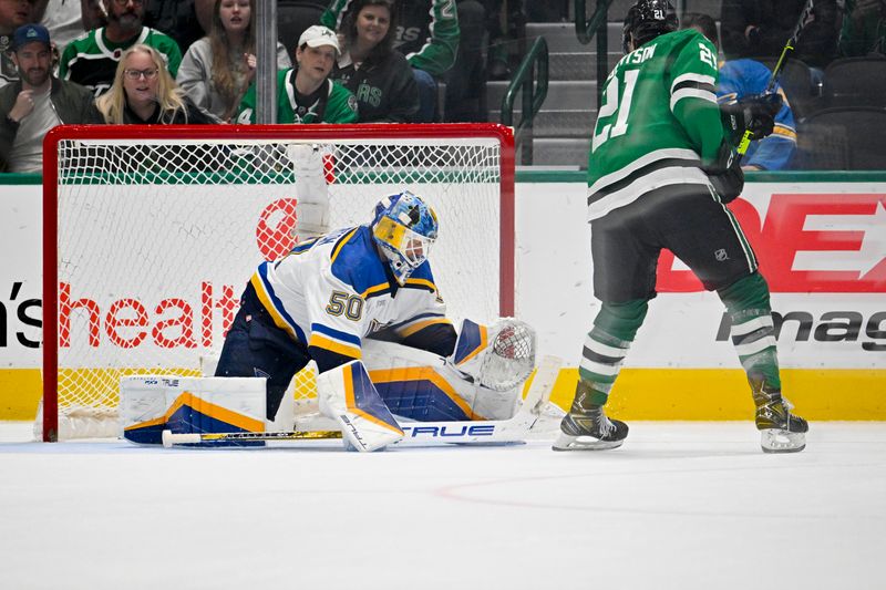 Apr 17, 2024; Dallas, Texas, USA; Dallas Stars left wing Jason Robertson (21) scores a goal against St. Louis Blues goaltender Jordan Binnington (50) during the overtime shootout at the American Airlines Center. Mandatory Credit: Jerome Miron-USA TODAY Sports