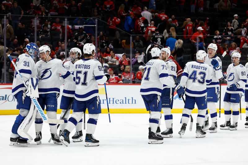 Nov 22, 2025; Washington, District of Columbia, USA; Tampa Bay Lightning goaltender Jonas Johansson (31) celebrates with teammates after their game against the Washington Capitals at Capital One Arena. Mandatory Credit: Geoff Burke-Imagn Images
