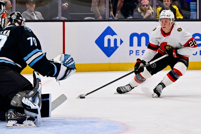 Jan 7, 2026; Salt Lake City, Utah, USA; Ottawa Senators left wing Fabian Zetterlund (20) stares down Utah Mammoth goalie Karel Vejmelka (70) before taking a shot during first period at Delta Center. Mandatory Credit: Peter Creveling-Imagn Images