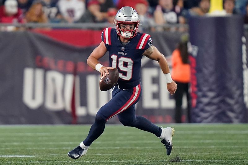 New England Patriots quarterback Trace McSorley scrambles while looking for a receiver during the second half of the team's NFL preseason football game against the Houston Texans, Thursday, Aug. 10, 2023, in Foxborough, Mass. (AP Photo/Steven Senne)