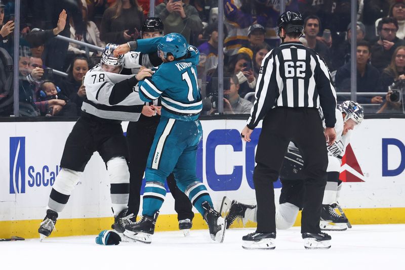 Dec 27, 2023; Los Angeles, California, USA; San Jose Sharks center Luke Kunin (11) and Los Angeles Kings right wing Alex Laferriere (78) fight during the third period of a game at Crypto.com Arena. Mandatory Credit: Jessica Alcheh-USA TODAY Sports