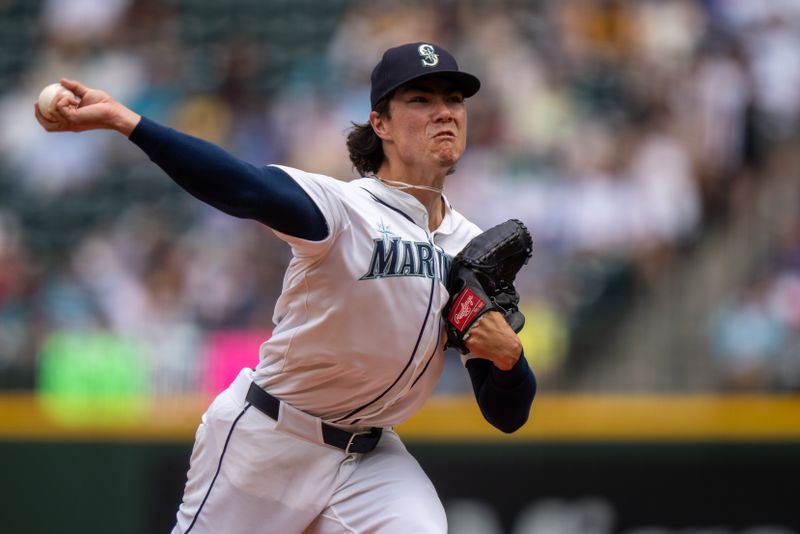 Aug 27, 2025; Seattle, Washington, USA;  Seattle Mariners starter Bryan Woo (22) delivers a pitch against the San Diego Padres at T-Mobile Park. Mandatory Credit: Stephen Brashear-Imagn Images