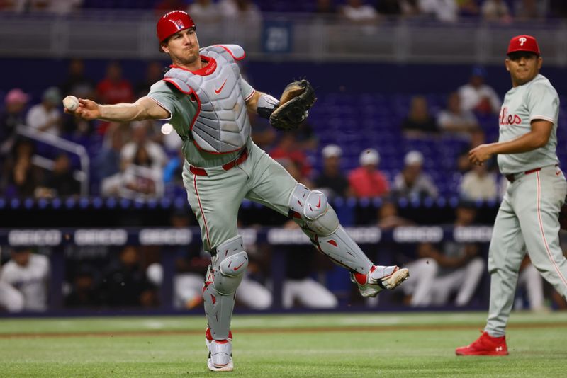 Sep 5, 2024; Miami, Florida, USA; Philadelphia Phillies catcher J.T. Realmuto (10) throws to first base to retire Miami Marlins shortstop Xavier Edwards (not pictured) during the fifth inning at loanDepot Park. Mandatory Credit: Sam Navarro-Imagn Images