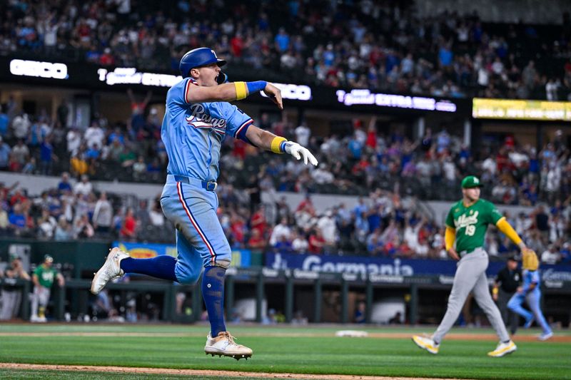 Sep 1, 2024; Arlington, Texas, USA; Texas Rangers third baseman Josh Jung (6) motions to the outfield after he hits a game winning three run walk-off home run off Oakland Athletics relief pitcher Mason Miller (19) during the tenth inning at Globe Life Field. Mandatory Credit: Jerome Miron-USA TODAY Sports