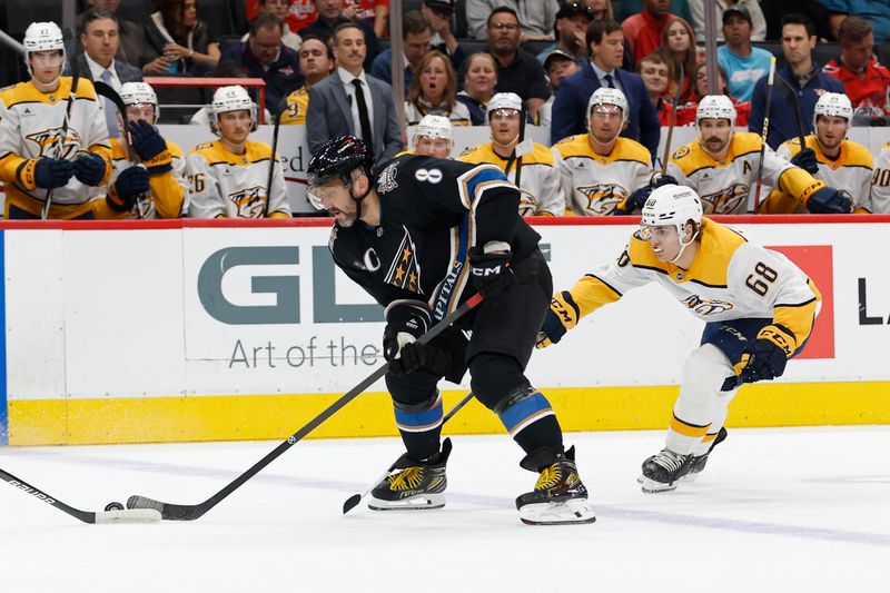 Nov 6, 2024; Washington, District of Columbia, USA; Washington Capitals left wing Alex Ovechkin (8) skates with the puck as Nashville Predators left wing Zachary L'Heureux (68) chases in the first period at Capital One Arena. Mandatory Credit: Geoff Burke-Imagn Images