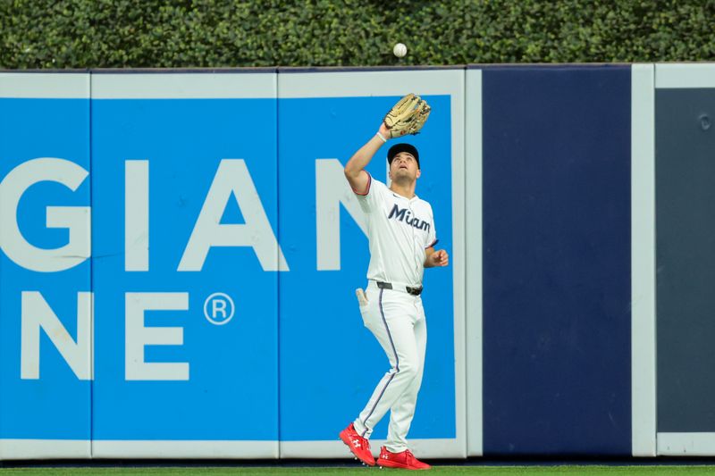 Sep 10, 2025; Miami, Florida, USA; Miami Marlins center fielder Jakob Marsee (87) catches a fly ball to retire Washington Nationals designated hitter Daylen Lile (not pictured) during the fourth inning at loanDepot Park. Mandatory Credit: Sam Navarro-Imagn Images