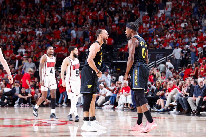 HOUSTON, TX - MAY 4:  Stephen Curry #30 and Jimmy Butler #10 of the Golden State Warriors celebrates during the game against the Houston Rockets during Round 1 Game 7 on May 4, 2025 at the Toyota Center in Houston, Texas. NOTE TO USER: User expressly acknowledges and agrees that, by downloading and or using this photograph, User is consenting to the terms and conditions of the Getty Images License Agreement. Mandatory Copyright Notice: Copyright 2025 NBAE (Photo by Logan Riely/NBAE via Getty Images)