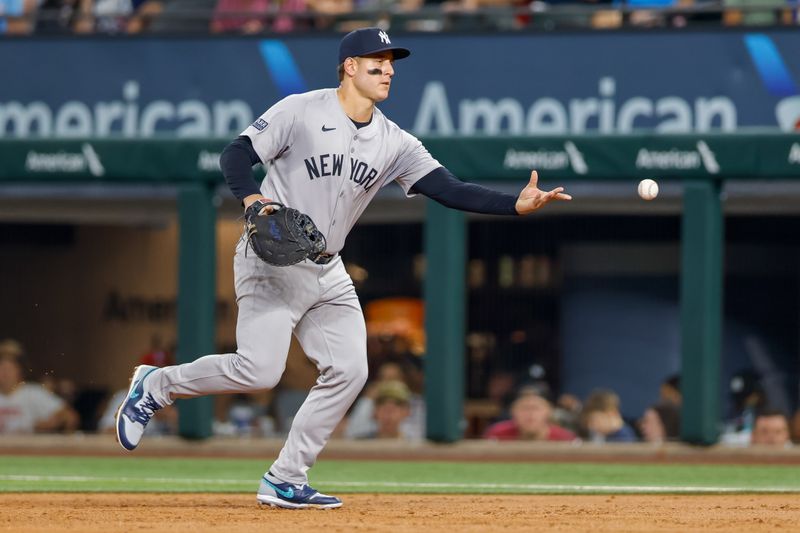 Sep 4, 2024; Arlington, Texas, USA; New York Yankees first base Anthony Rizzo (48) tosses the ball during the third inning against the Texas Rangers at Globe Life Field. Mandatory Credit: Andrew Dieb-Imagn Images