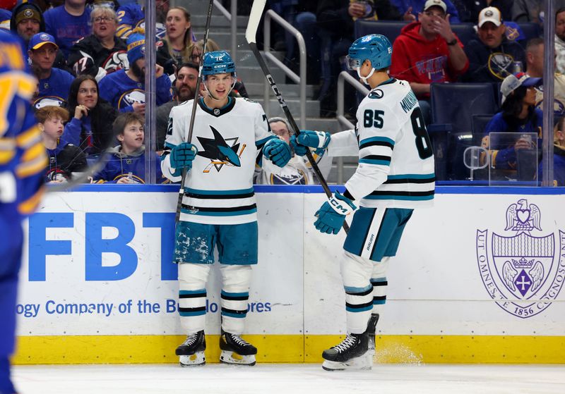 Mar 4, 2025; Buffalo, New York, USA;  San Jose Sharks left wing William Eklund (72) celebrates his goal with defenseman Shakir Mukhamadullin (85) during the third period against the Buffalo Sabres at KeyBank Center. Mandatory Credit: Timothy T. Ludwig-Imagn Images