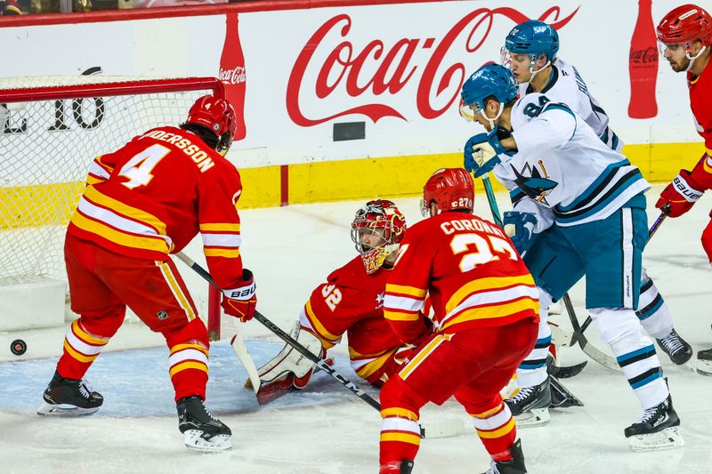 Apr 13, 2025; Calgary, Alberta, CAN; San Jose Sharks defenseman Jan Rutta (84) scores a goal against Calgary Flames goaltender Dustin Wolf (32) during the second period at Scotiabank Saddledome. Mandatory Credit: Sergei Belski-Imagn Images