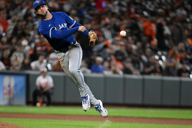 May 13, 2024; Baltimore, Maryland, USA; 
Toronto Blue Jays second baseman Ernie Clement (28) throws to first base during the seventh inning against the Baltimore Orioles  at Oriole Park at Camden Yards. Mandatory Credit: Tommy Gilligan-USA TODAY Sports