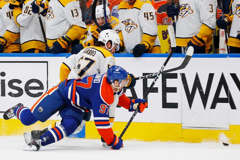Jan 27, 2024; Edmonton, Alberta, CAN; Nashville Predators defensemen Dante Fabbro (57) trips up Edmonton Oilers forward Connor McDavid (97) during the third period at Rogers Place. Mandatory Credit: Perry Nelson-USA TODAY Sports