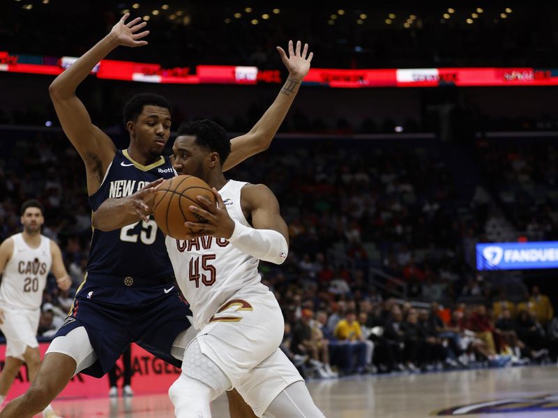 NEW ORLEANS, LOUISIANA - MARCH 13: Donovan Mitchell #45 of the Cleveland Cavaliers drives the ball around Trey Murphy III #25 of the New Orleans Pelicans at Smoothie King Center on March 13, 2024 in New Orleans, Louisiana.   NOTE TO USER: User expressly acknowledges and agrees that, by downloading and or using this photograph, User is consenting to the terms and conditions of the Getty Images License Agreement.  (Photo by Chris Graythen/Getty Images)