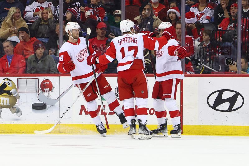 Dec 23, 2023; Newark, New Jersey, USA; Detroit Red Wings defenseman Shayne Gostisbehere (41) celebrates his goal against the New Jersey Devils during the second period at Prudential Center. Mandatory Credit: Ed Mulholland-USA TODAY Sports