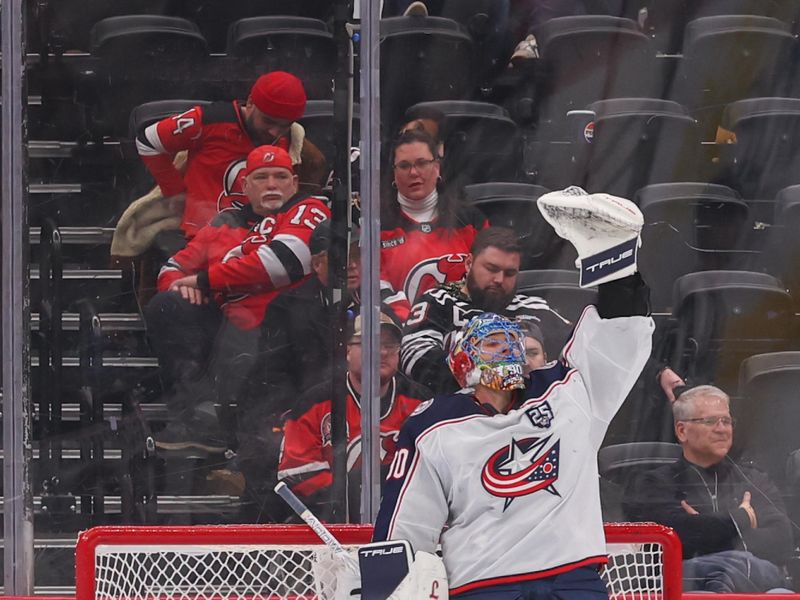 Feb 3, 2026; Newark, New Jersey, USA; Columbus Blue Jackets goaltender Elvis Merzlikins (90) celebrates his shutout win over the New Jersey Devils at Prudential Center. Mandatory Credit: Ed Mulholland-Imagn Images