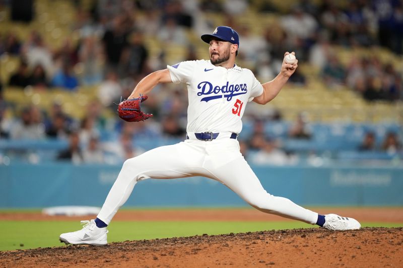 Aug 21, 2024; Los Angeles, California, USA; Los Angeles Dodgers relief pitcher Alex Vesia (51) throws in the ninth inning against the Seattle Mariners at Dodger Stadium. Mandatory Credit: Kirby Lee-USA TODAY Sports